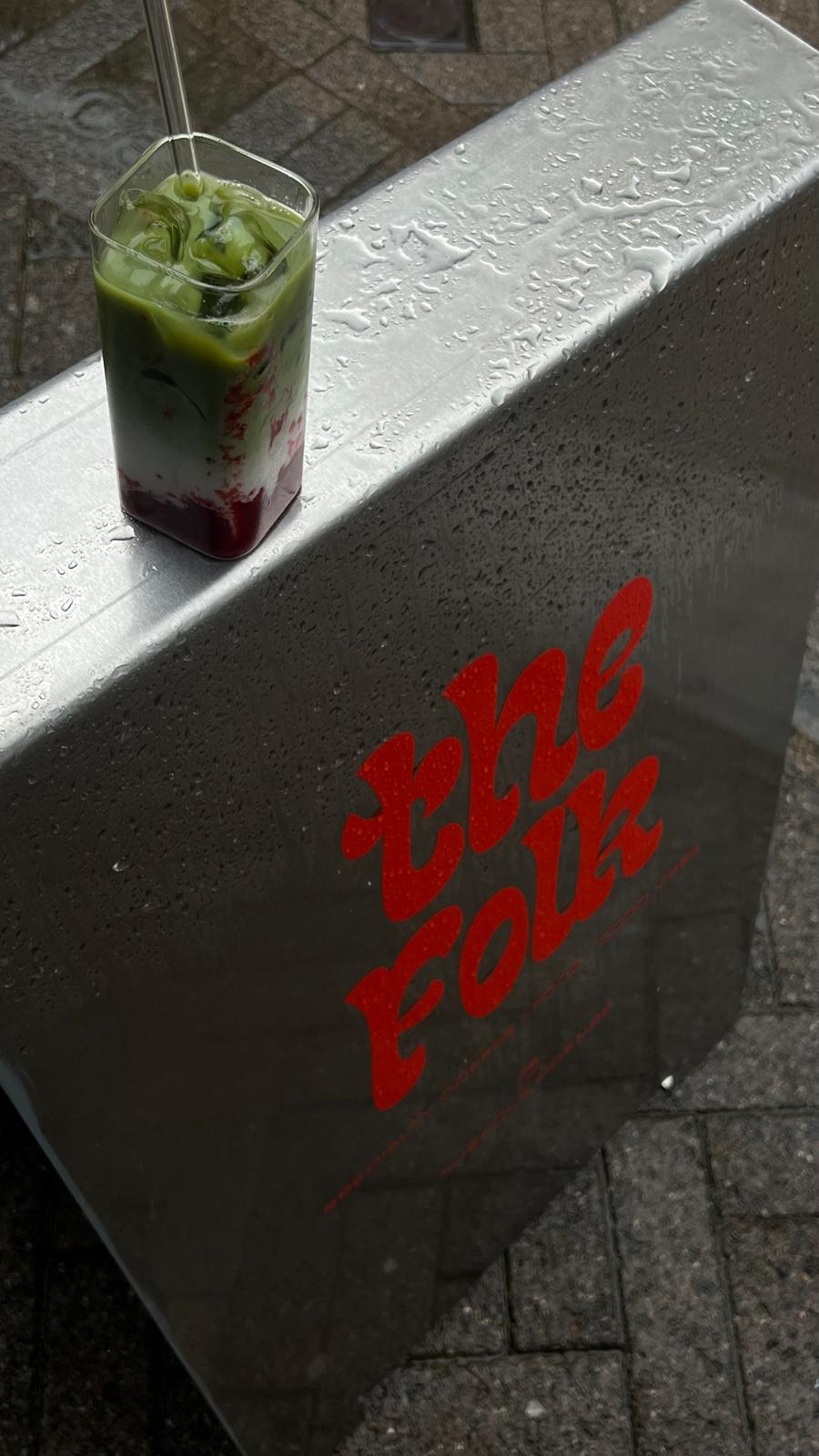 the folk sign with strawberry iced match in a rainy weather