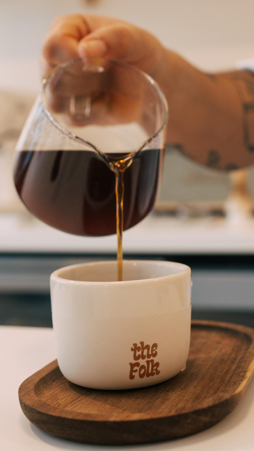 v60 poured from glass pot into customized the folk cup
